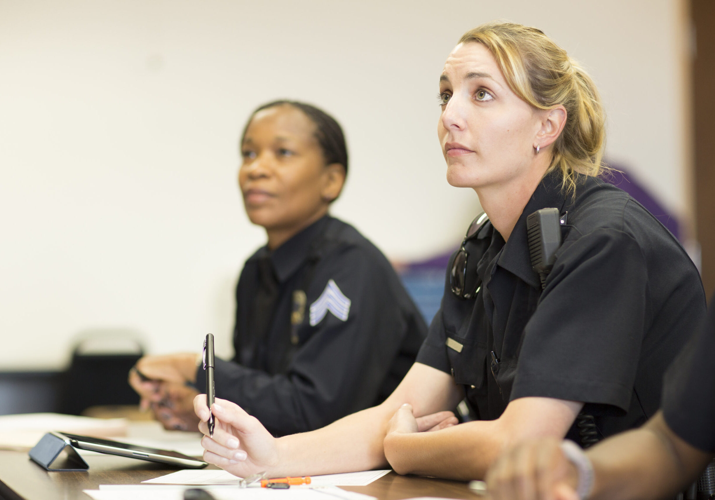 EMERGENCY SERVICES - Policewomen in classroom