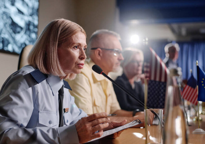 Politics in uniform speaking her speech at conference during interview for journalists